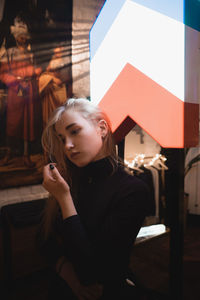 Young woman portrait in the cafe with backlight