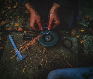 Low section of man holding camera