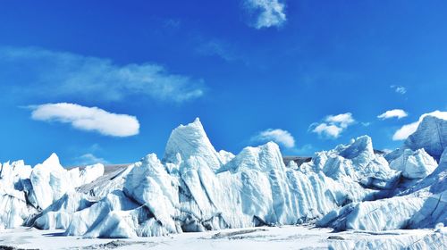 Scenic view of glacier against sky