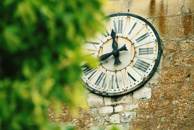 Close-up of clock on wall