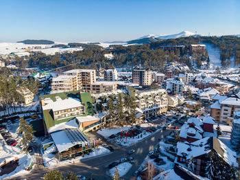 High angle view of townscape against blue sky