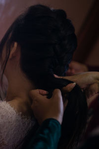 Close-up portrait of woman holding hands