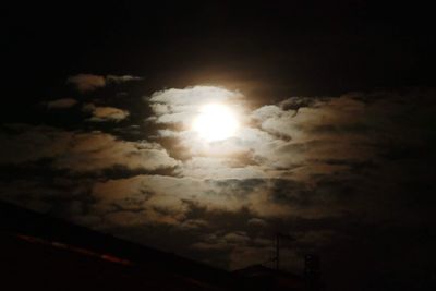 Low angle view of moon in sky at night