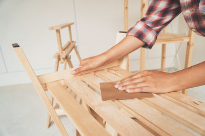 Low section of person on table at home