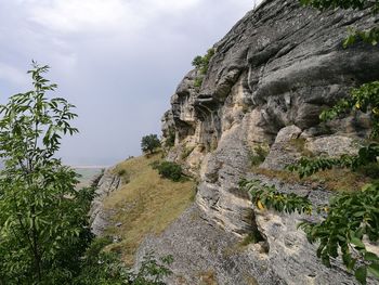 Scenic view of cliff against sky