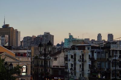 Buildings in city against sky