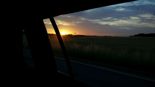 Scenic view of landscape against sky at sunset