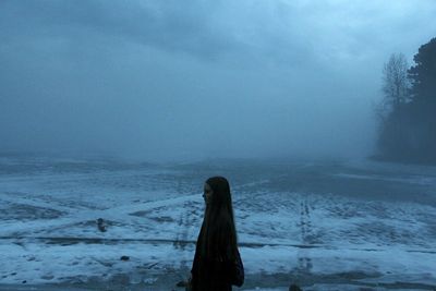 Silhouette of person standing on field