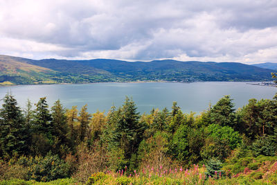 Scenic view of lake and mountains against sky