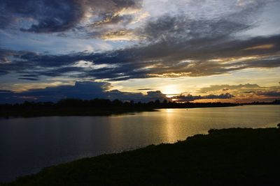 Scenic view of lake against sky during sunset