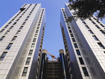 Low angle view of modern buildings against clear sky