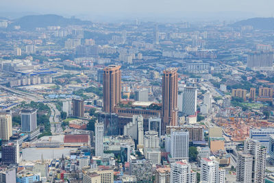 High angle view of modern buildings in city against sky