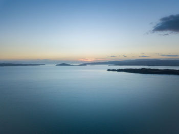 Scenic view of sea against clear sky during sunset