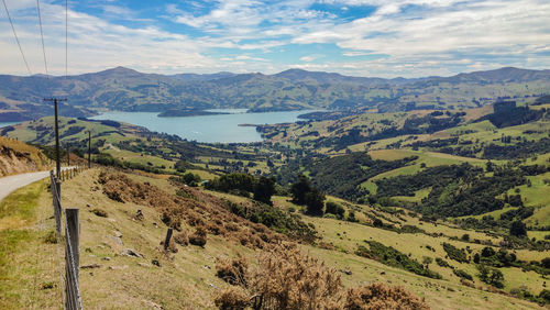 Scenic view of landscape and mountains against sky