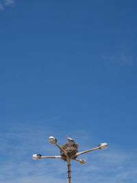 Low angle view of statue against clear blue sky