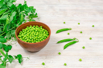 High angle view of green peas on table