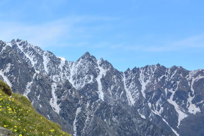 Scenic view of snowcapped mountains against sky