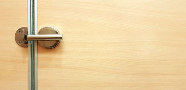 Close-up of wooden door handle