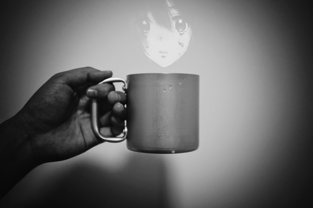 indoors, person, holding, part of, human finger, cropped, close-up, table, studio shot, home interior, copy space, food and drink, unrecognizable person, wall - building feature, still life, lifestyles, men