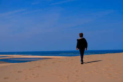 Woman standing on beach