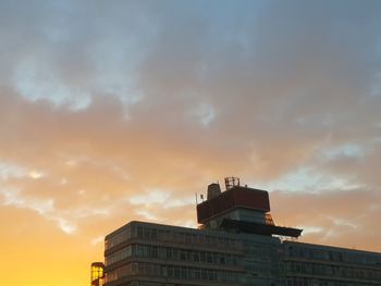 Low angle view of building against sky during sunset