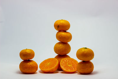 Close-up of oranges against white background