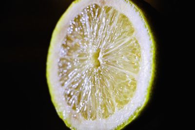 Close-up of apple against black background