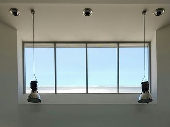 Pendant lights by window in building