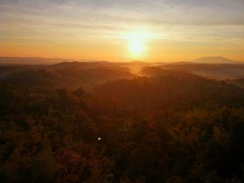 Scenic view of landscape against sky during sunset