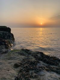 Scenic view of sea against sky during sunset