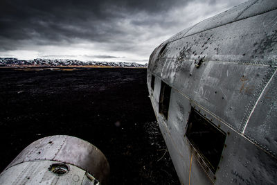 Crashed plane in basaltic desert of iceland from the side