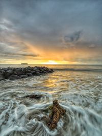 Scenic view of sea against sky during sunset