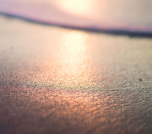 Close-up of wood against sky during sunset