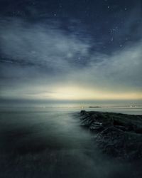 Scenic view of sea against sky at night