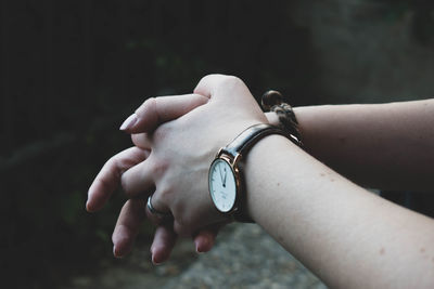 Close-up of human hand against blurred background