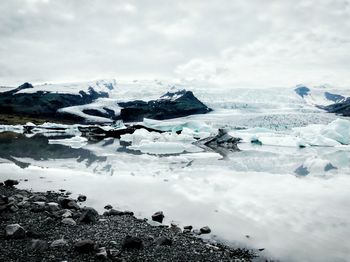 Scenic view of frozen sea against sky