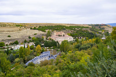 High angle view of trees and buildings against sky