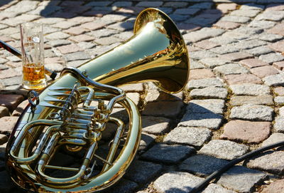 Close-up of music instrument of cobbled footpath