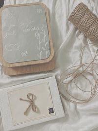 High angle view of greeting card and spool on table