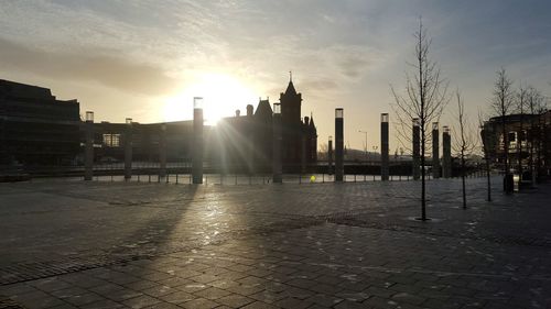 Sun shining through buildings