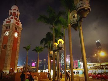 Low angle view of illuminated tower at night