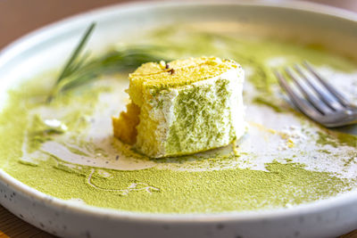 Close-up of green leaf on plate