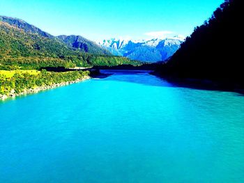 View of lake against blue sky