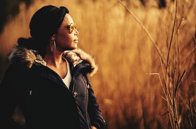 Side view of young woman looking away