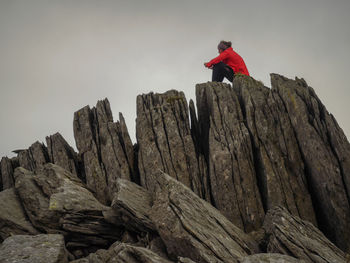 Low angle view of woman against sky