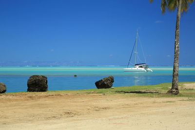 Scenic view of sea against blue sky