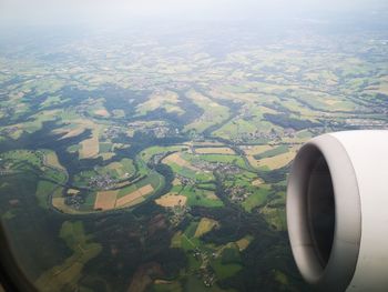 Aerial view of landscape seen through airplane window