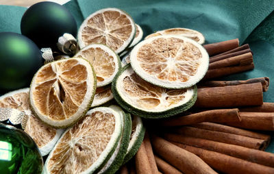 High angle view of fried fruits and cinamon on table