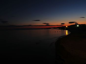 Scenic view of sea against sky at dusk