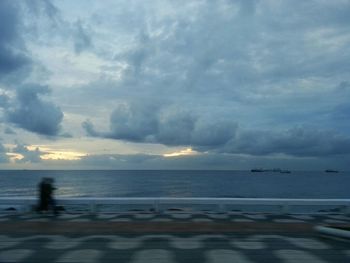 Scenic view of sea against cloudy sky